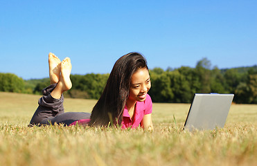 Image showing Girl on Laptop in Meadow