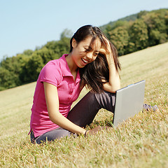 Image showing Girl on Laptop in Meadow