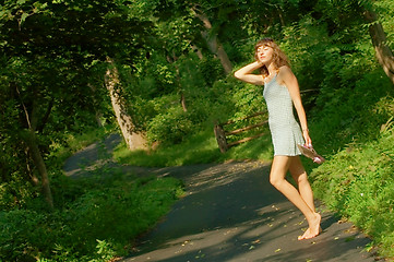 Image showing Pretty girl on forest path