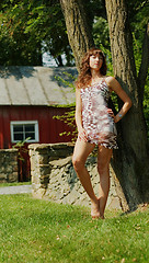 Image showing Girl Leaning Against Tree