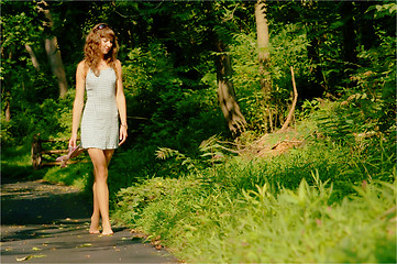 Image showing Pretty girl on forest path