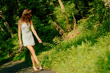 Image showing Pretty girl on forest path