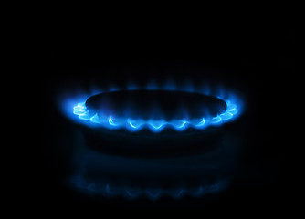 Image showing Gas burner with flames on dark background