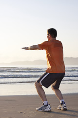 Image showing Jogger doing squats