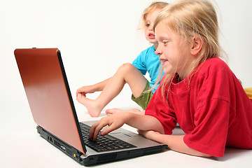 Image showing Playing on laptop