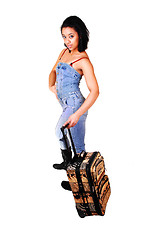 Image showing Girl in jeans suit on a trip.