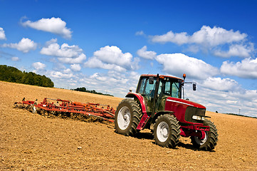 Image showing Tractor in plowed field