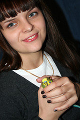 Image showing younger woman and green parrot