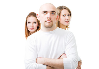 Image showing positive young man with two women