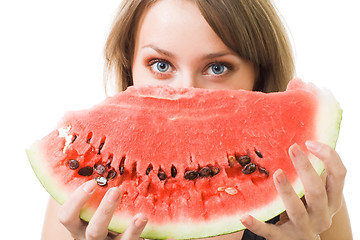 Image showing woman stare behind watermelon