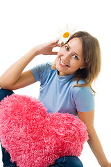 Image showing Woman sit with camomile and teddy red heart
