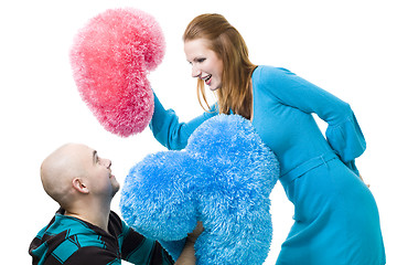 Image showing Couple fighting with cushions