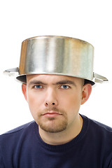 Image showing  serious man with stew pan on head