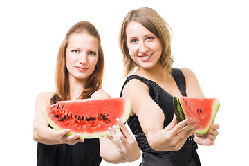 Image showing Two woman with lobule of watermelon