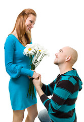Image showing Man giving camomile to woman