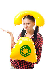 Image showing Confused woman with telephone