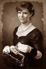 Image showing Vintage looking woman with dollar and purse