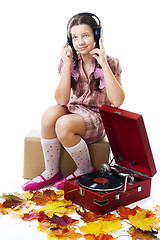 Image showing Teenager girl listen music with gramophone