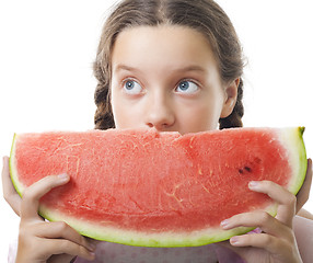 Image showing  teenager girl look eating watermelon