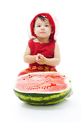 Image showing Baby sit with watermelon