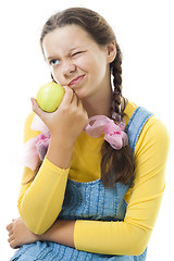 Image showing dissatisfied teenager girl with apple 