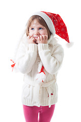 Image showing Little girl in santa cap wait for christmas