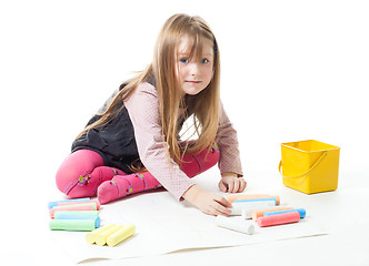 Image showing Little girl draw with chalks