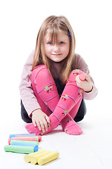 Image showing LIttle girl with color chalks