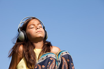 Image showing young child listening music