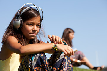 Image showing young child listening music