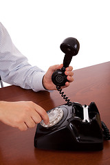 Image showing dialing a number on the telephone