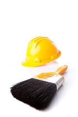 Image showing construction helmet and a paint brush