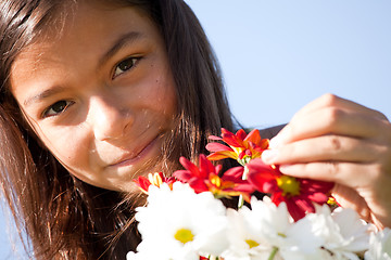 Image showing Little child with fresh flowers