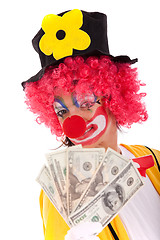 Image showing Funny clown holding money