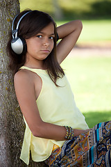 Image showing young child listening music
