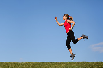 Image showing Jumping at the top of the hill