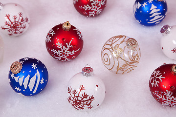 Image showing Christmas balls in the snow