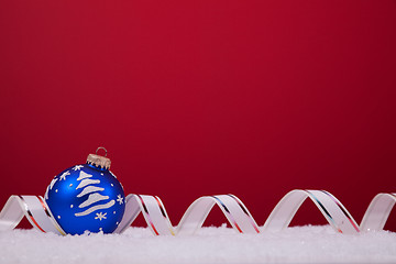 Image showing Christmas balls over a red background