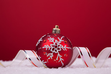 Image showing Christmas balls over a red background