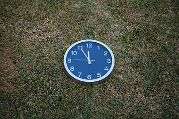 Image showing Wall clock in the grass