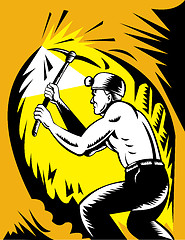 Image showing Coal miner at work with pick ax