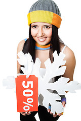 Image showing Woman hold snowflake with sale tag