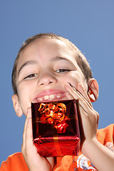 Image showing boy with large present at christmas time