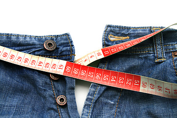 Image showing measuring tape around womans trousers