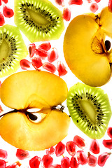 Image showing beautiful pomegranate grains, kiwi and tasty apple 