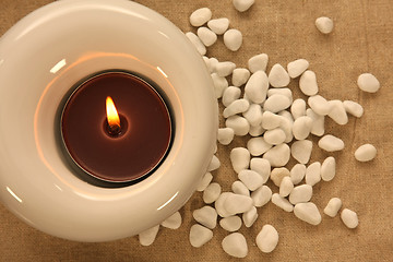 Image showing candles and massage stones in a calm zen spa