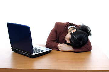 Image showing young woman dreaming on laptop