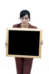 Image showing Young woman holding blank board