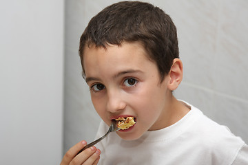 Image showing beautiful child eating