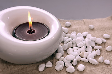 Image showing candles and massage stones in a calm zen spa